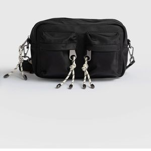 Saint Sophia crossbody bag. Black with tassels.